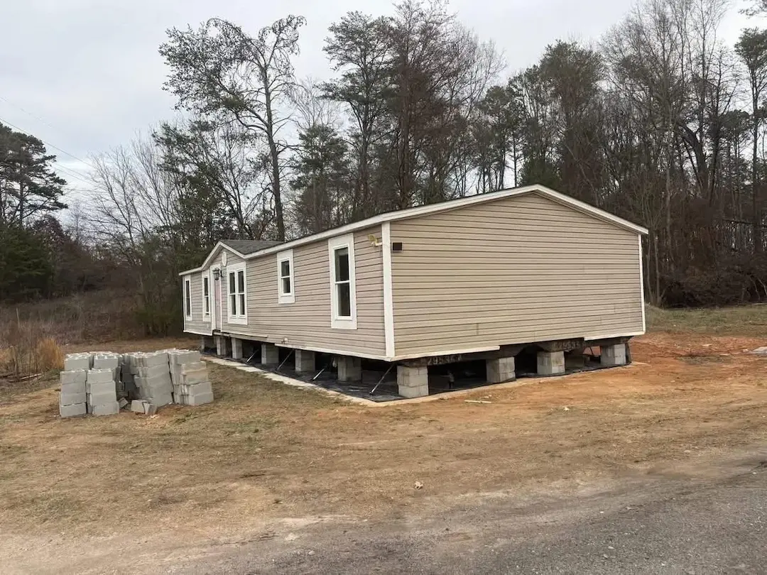 Double-wide mobile home setup and leveling on foundation blocks in Virginia by Interstate Mobile Home Movers