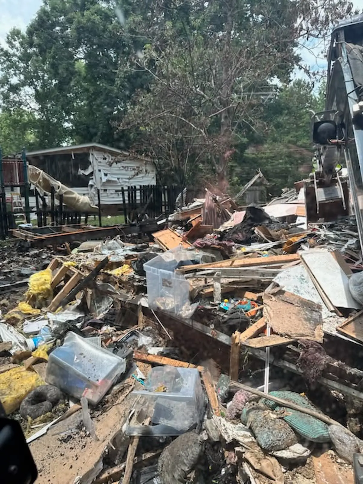 Mobile home demolition with excavator